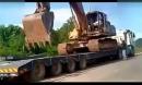 实拍大卡特330挖掘机上大卡车视频